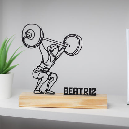 Escultura de mulher a praticar snatch no CrossFit, peça decorativa com base de madeira personalizada.